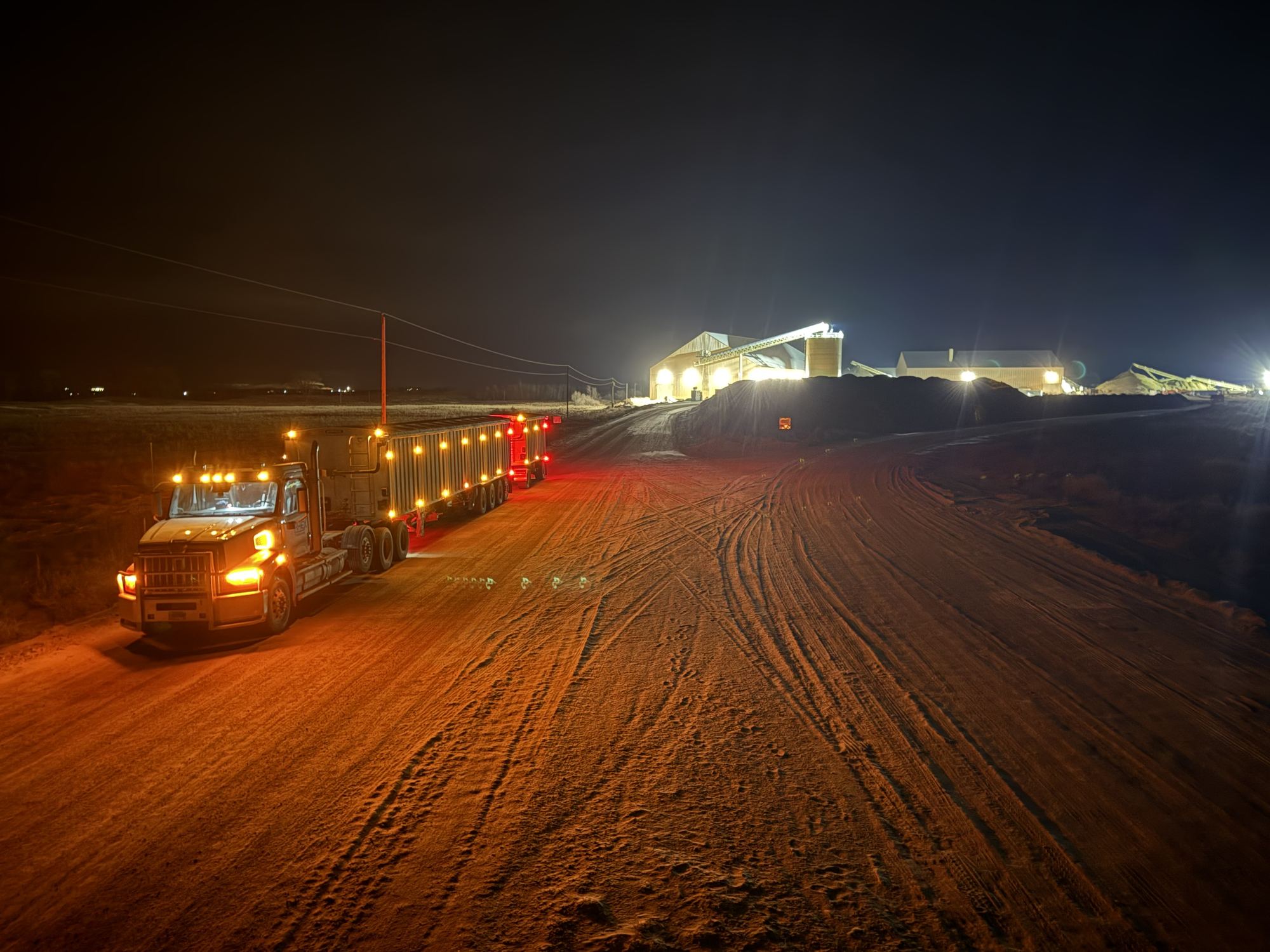 Truck leaving a loadout at night